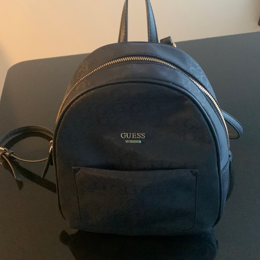 Like new mini Guess purse backpack.